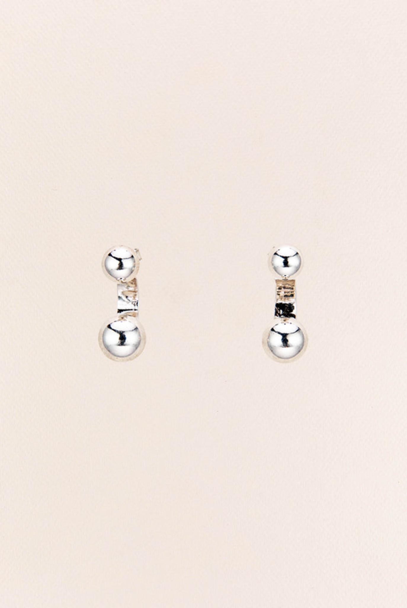 Stud earrings with floating balls