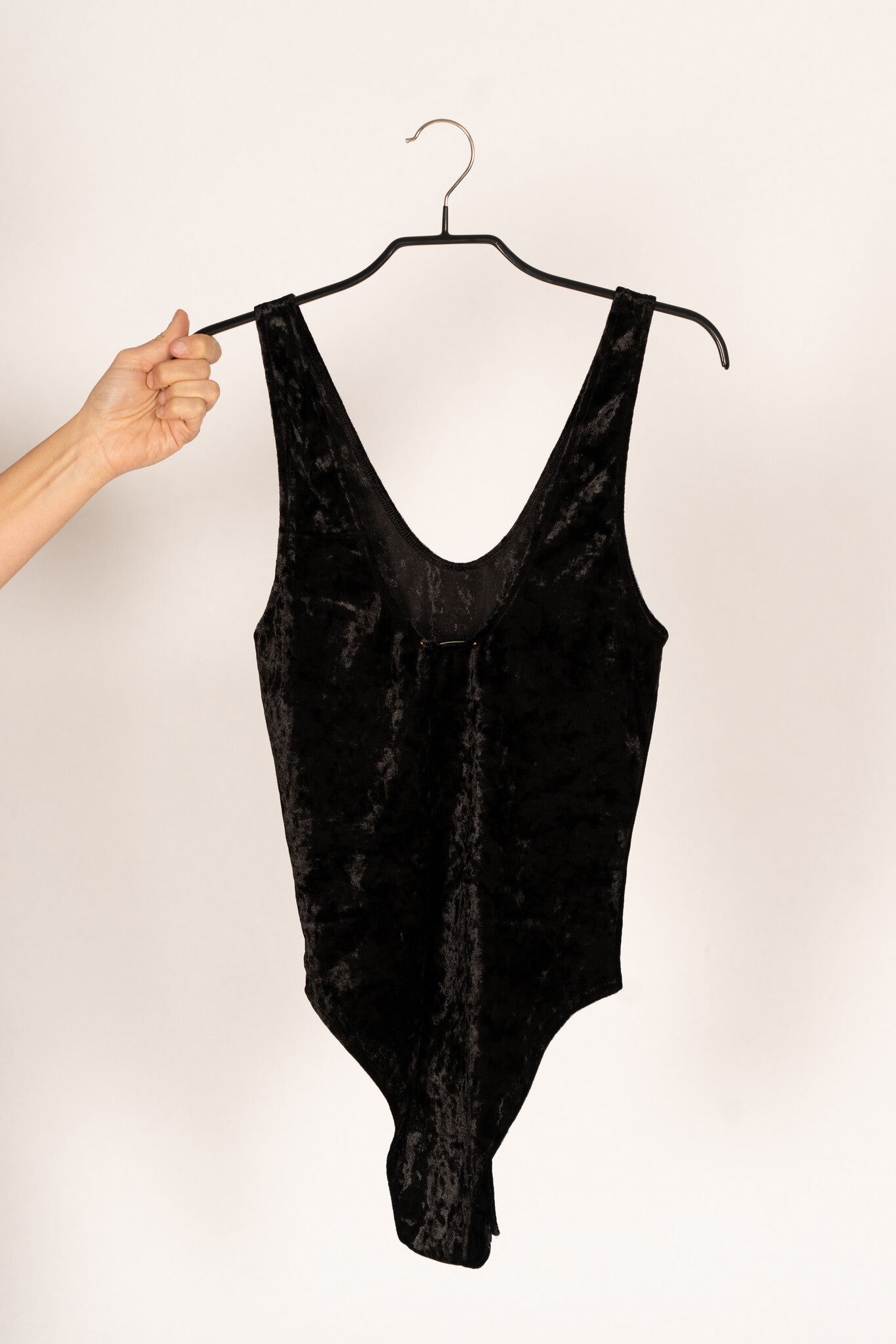 Make a statement in the Stretch Velvet Cut Out Bodysuit. Shop now