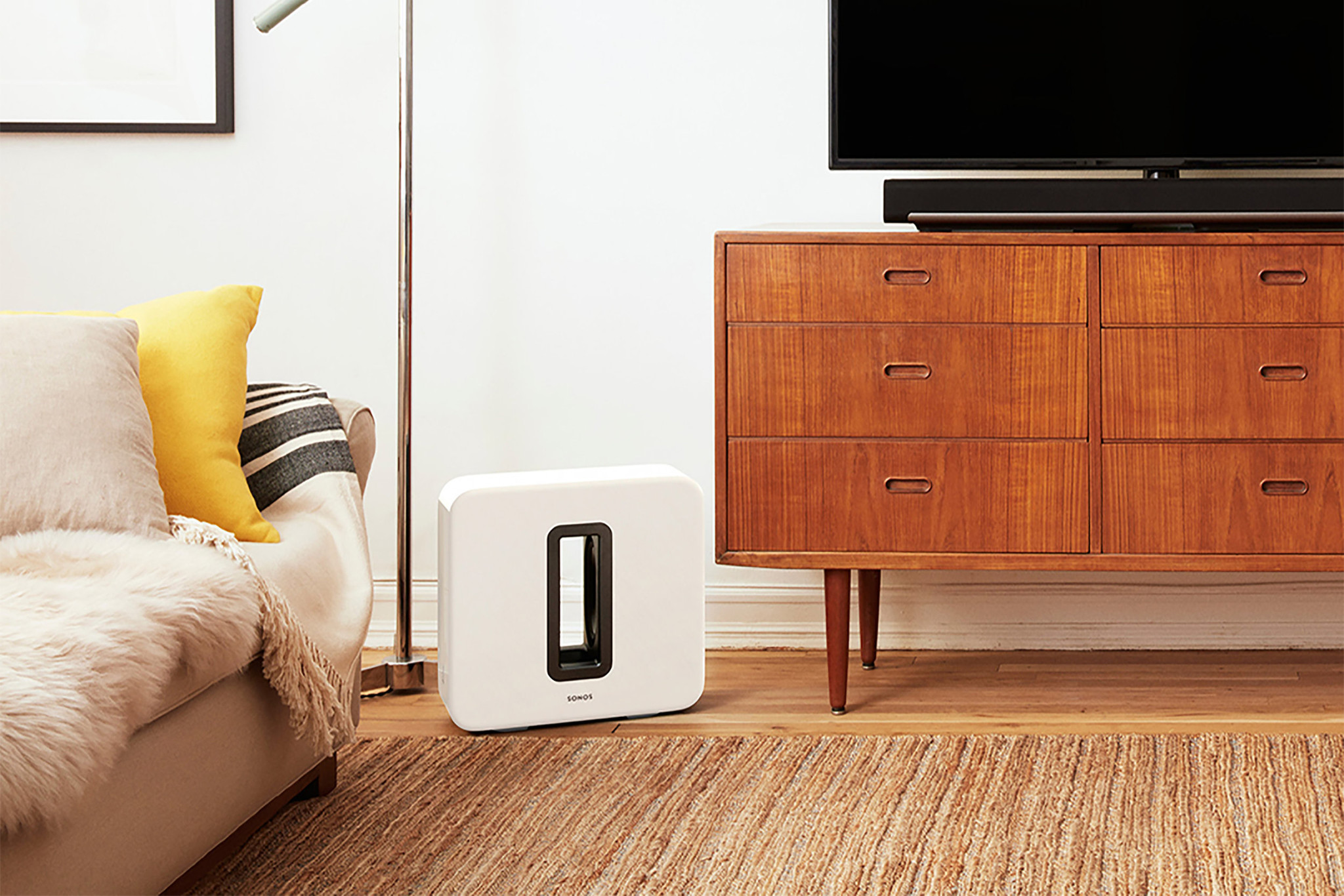 a speaker in a home on a laminate floor