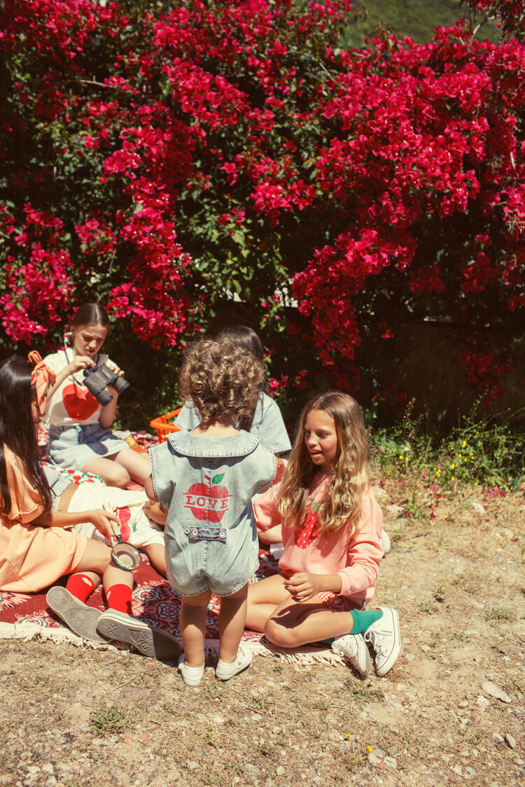 Piupiuchick short sleeveless jumpsuit | blue light denim w/ apple print