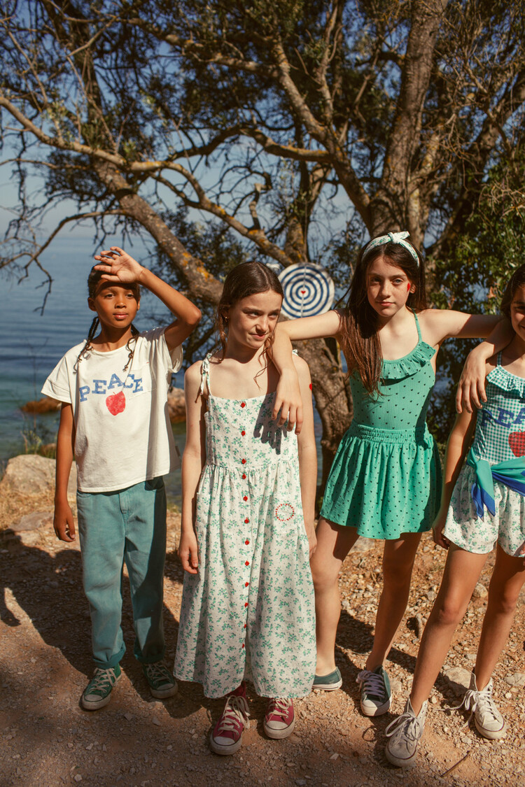 Piupiuchick short skirt | green w/ black hearts allover