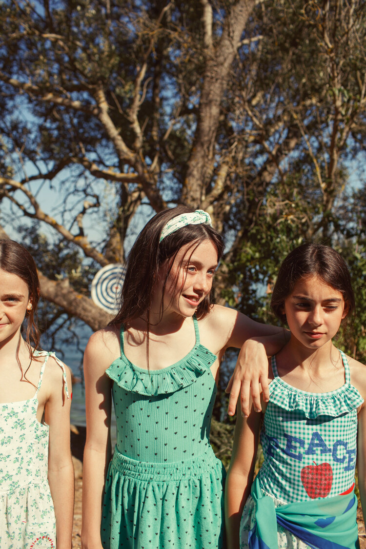 Piupiuchick short skirt | green w/ black hearts allover