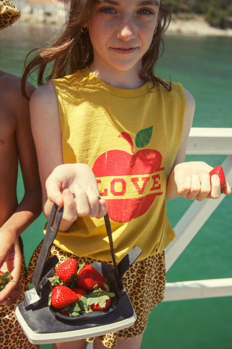 Piupiuchick sleeveless top | mustard w/ apple print