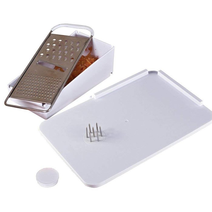 Sandwich board with fixation pins and grater