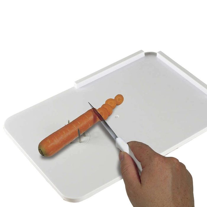 Sandwich board with fixation pins and grater