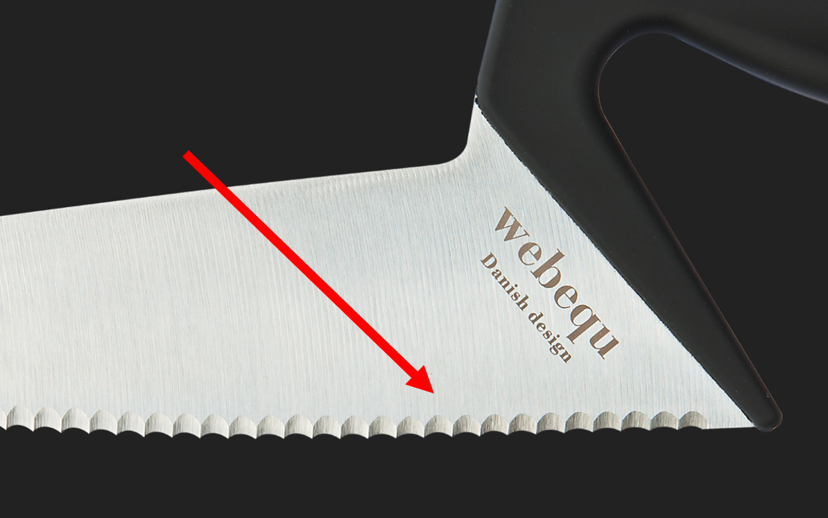 close-up bread knife left-handed