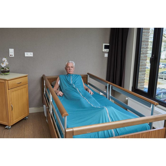Green nursing blanket completely around the mattress for restless sleepers