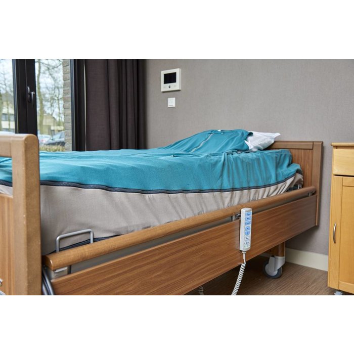 Green nursing blanket completely around the mattress for restless sleepers