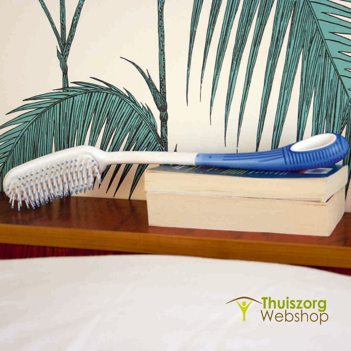 Ergonomic Etac hair wash brush with extended handle