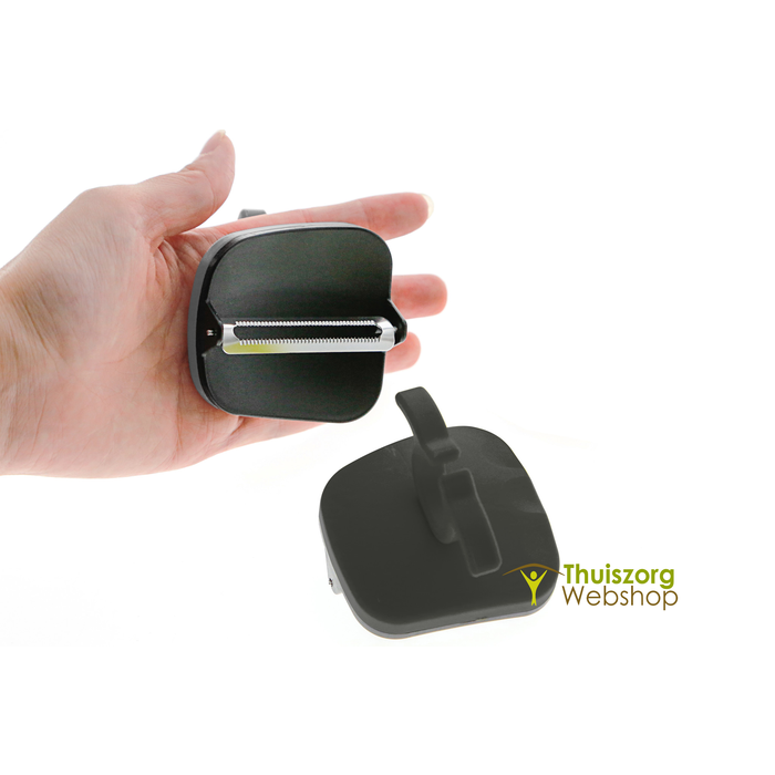 Ergonomic finger-grip peeler with straight or serrated cutting blades