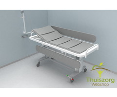 Shower / care table electrically adjustable in height