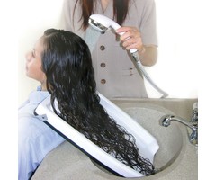 Hair wash tray with raised edge