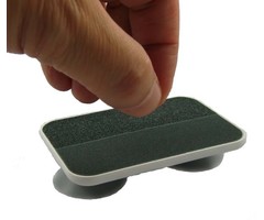 Nail file on suction cups for one-handed use