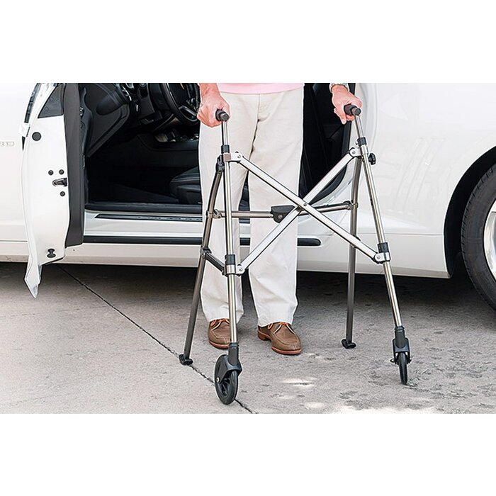 Foldable walking frame on wheels