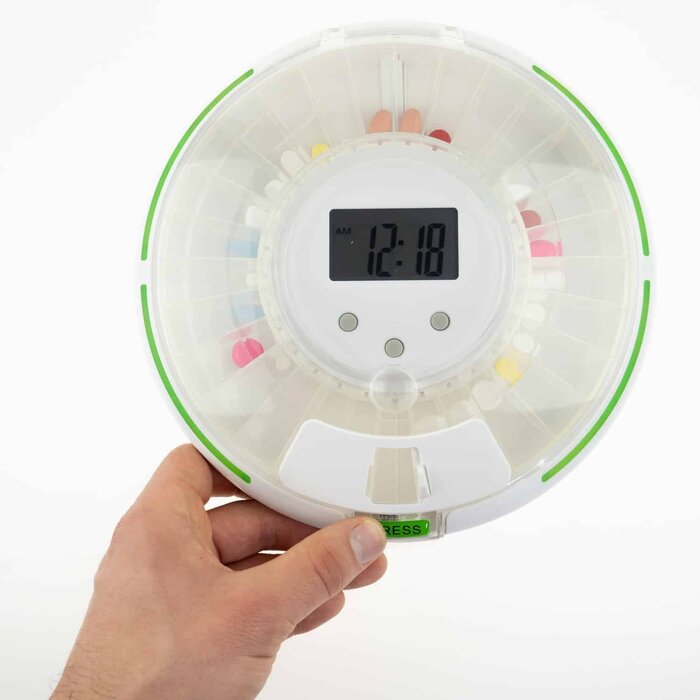 Secured medicine carousel with 6 alarms and green flashing border