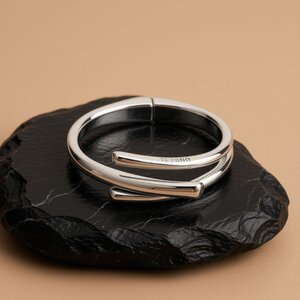 UNOde50 UNOde50 Armband | Bangle | Drie Verweven Organische Vormen | SS26