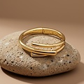 UNOde50 UNOde50 Armband | Bangle | Drie Verweven Organische Vormen | VERGULD | SS26