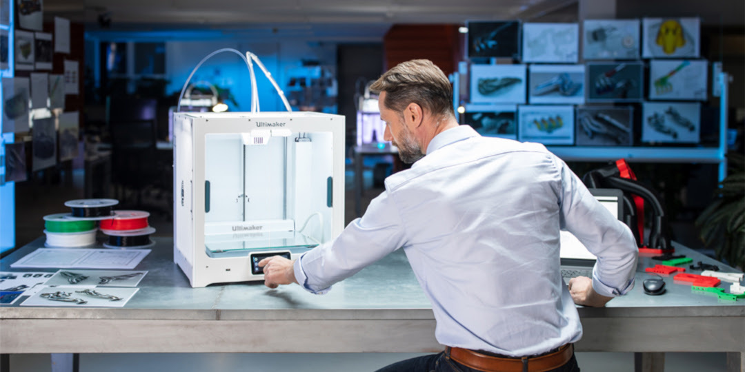 Man at a desk interacting with the Ultimaker S5