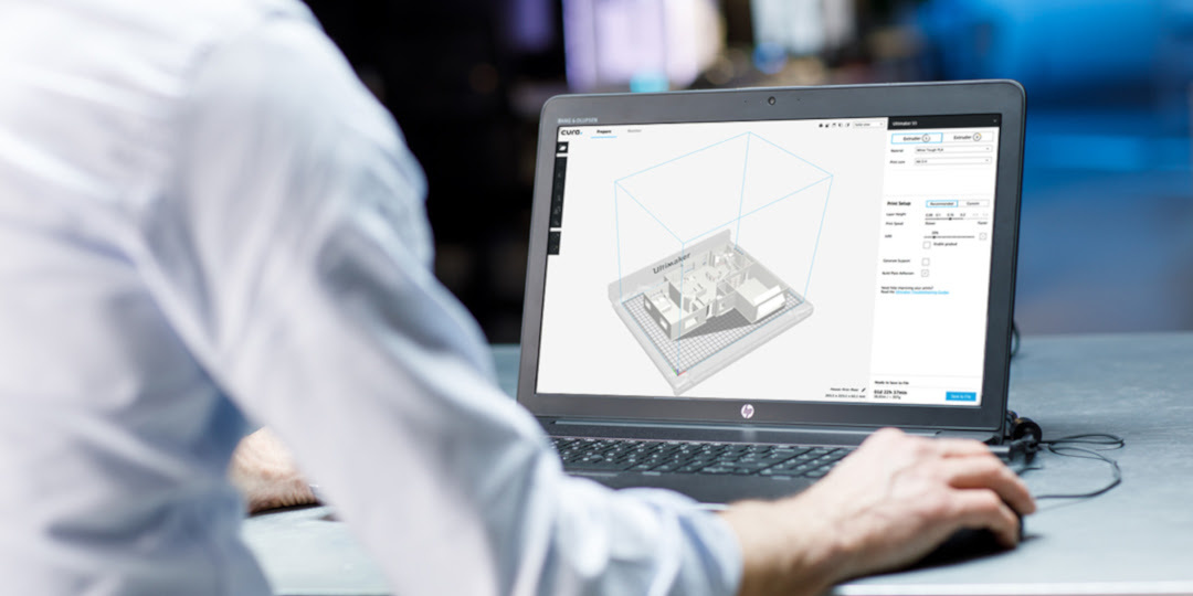 Man working on a laptop with Ultimaker Cura