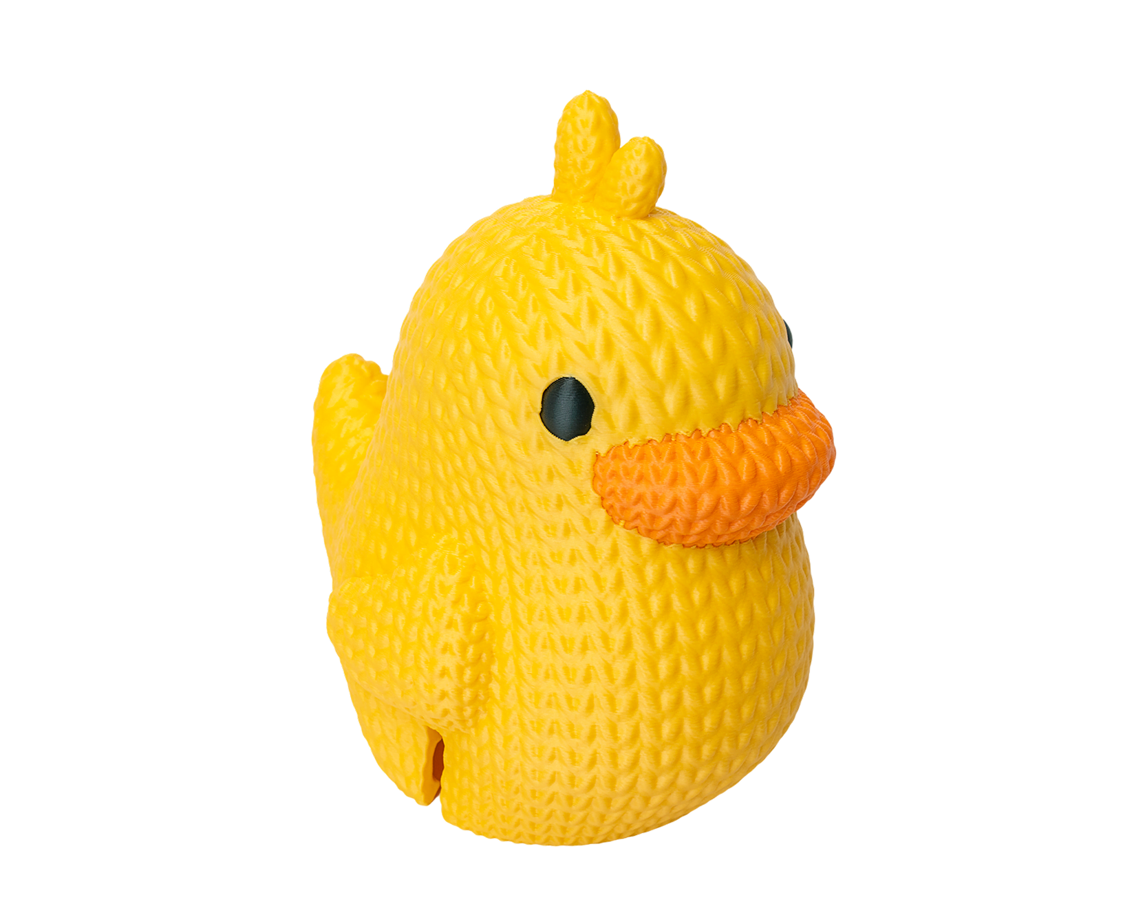 Una figurita de pato impresa en 3D en varios colores con una textura única de lana tejida, realizada con filamentos amarillos, naranjas y negros.