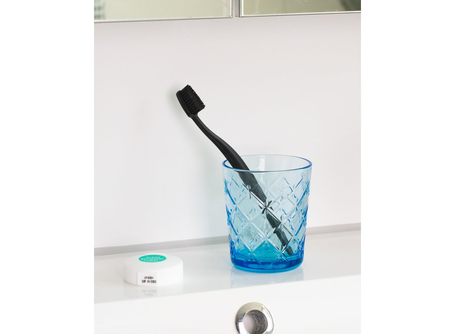 Black ecological toothbrush with activated charcoal