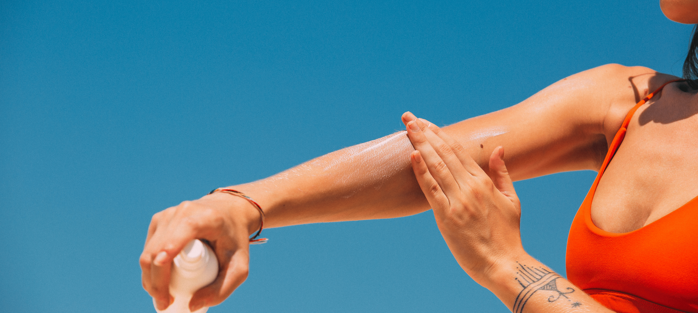 Why does sunscreen leave a white cast and how do you prevent it?