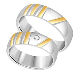 18 karat white and yellow gold wedding rings with matt and shiny finish with 0.05 ct diamond