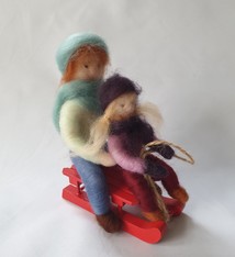 De Wolshoop Vader en dochter op slee