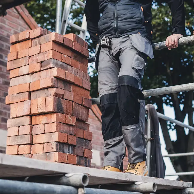 Scruffs Werkbroek met holsterzakken - polyester/katoen - maat 52 L - donkergrijs - kniezakken, versterkt zitvlak voor bouw