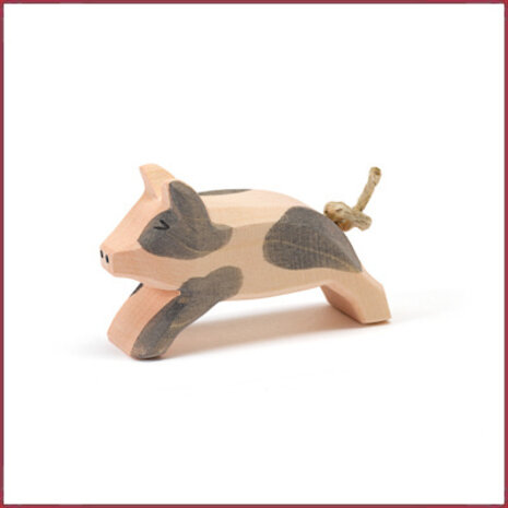 Ostheimer Gevlekt biggetje rennend Ostheimer Gevlekt biggetje rennend