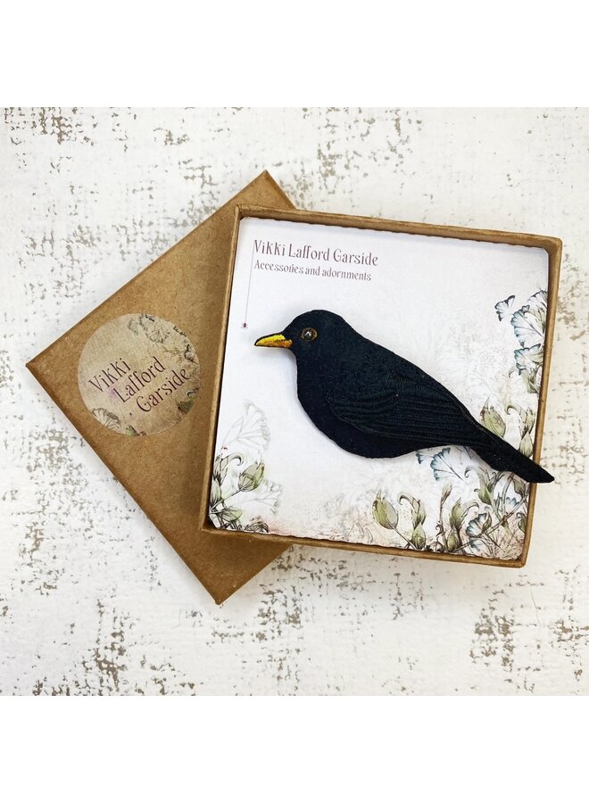 Koltrastenäbb vänster brosch 135