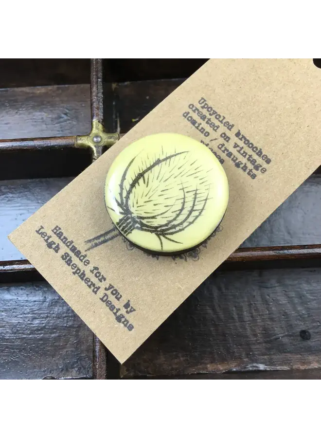 Teasel Draughts Piece Brooch on card  74