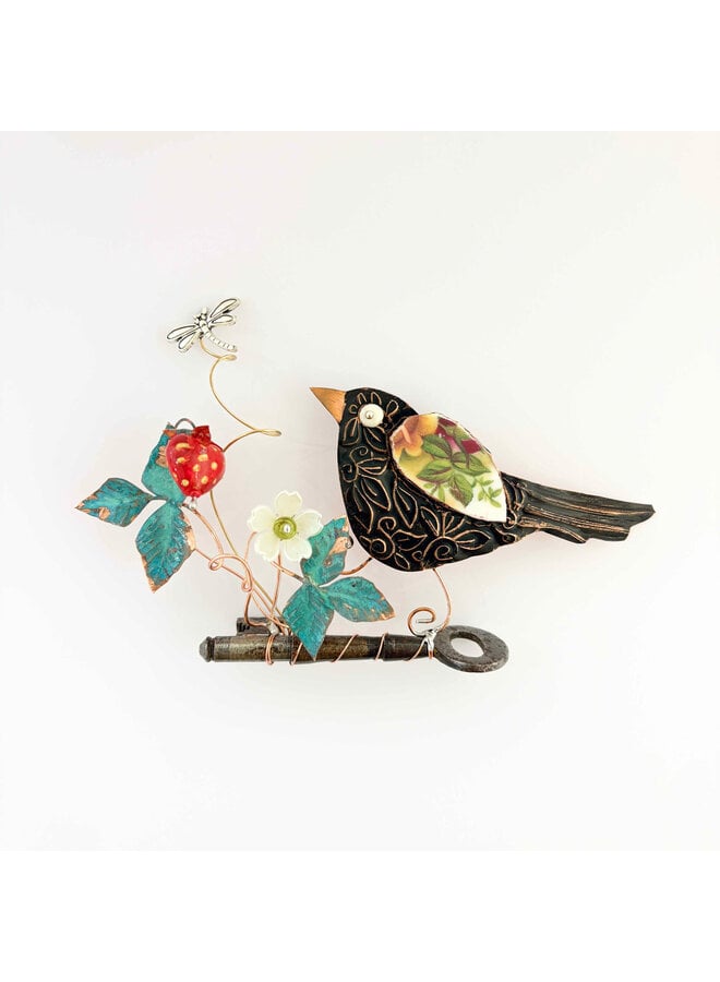 Blackbird with Strawberry on a Key