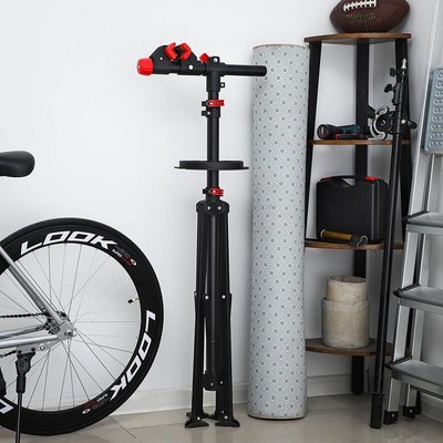 Songmics | Sterke Verstelbare Fiets Montagestandaard | Montage Stang voor uw Fiets, Mountainbike of Racefiets | Verstelbare Reparatie Montage Standaard | Montage Standaard Inklapbaar | In hoogte verstelbaar van 114 tot 195 Cm | Kleur: Zwart