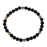 Onyx armband met 6 gouden (14k) kralen Onyx armband met 6 gouden (14k) kralen