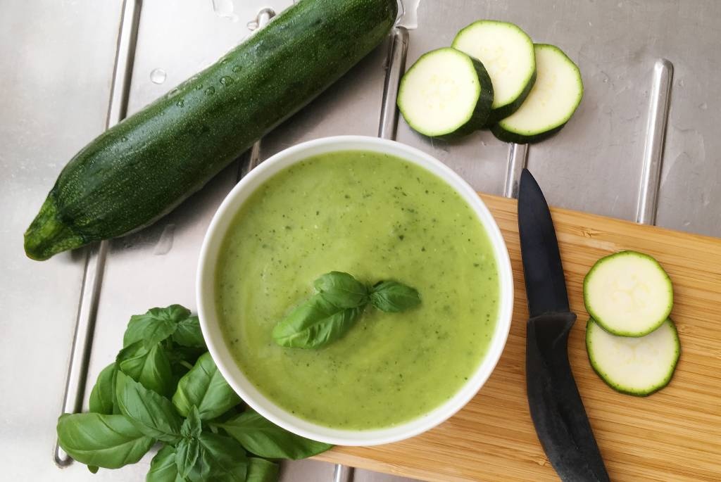 Cold zucchini soup with lemon oil and basil
