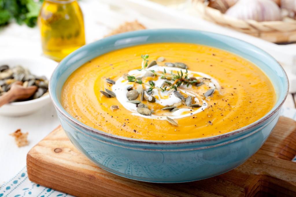 Thai Pumpkin soup with red curry, coconut and roasted peanuts