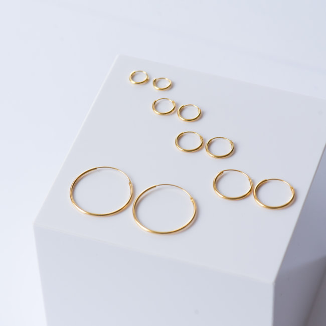 KARMA Paar goud creool oorbellen