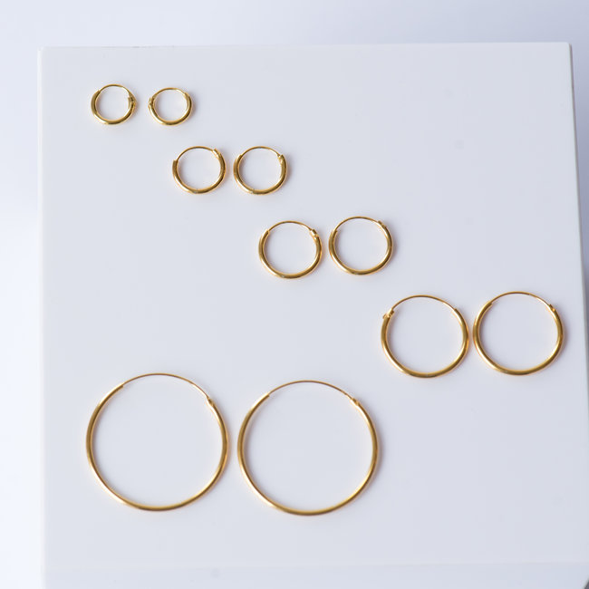 KARMA Paar goud creool oorbellen