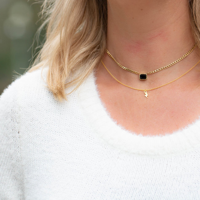 Goud ketting van Karma met bliksem