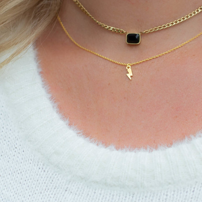 Goud ketting van Karma met bliksem