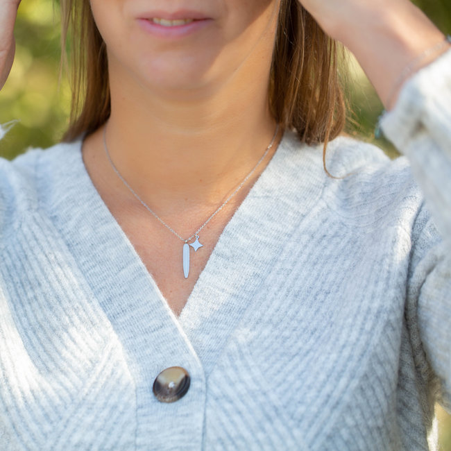 Zilver ketting met veer en ster