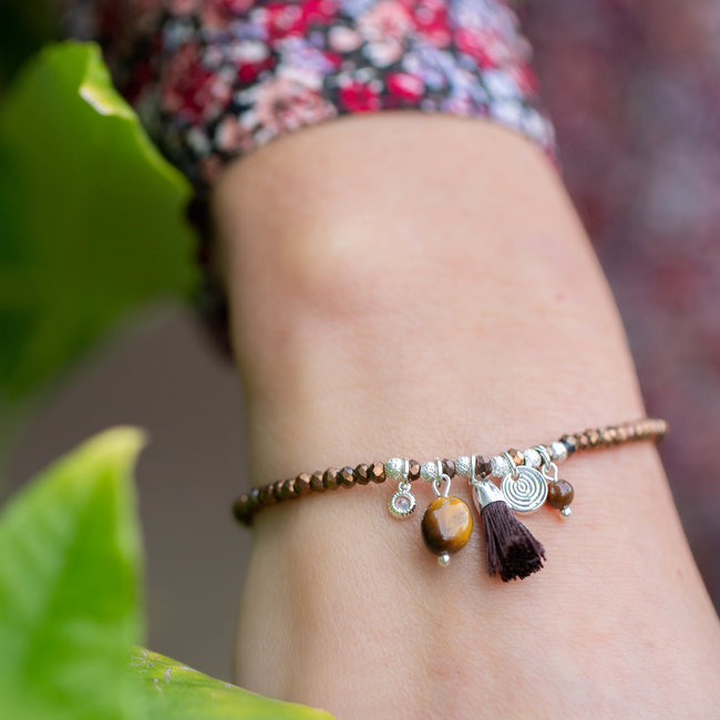 Bruin facetkralen armband met kwast