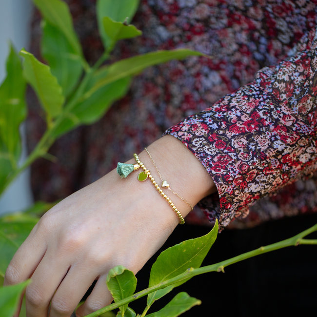 Goud armbandje hartje of kralenbandje kwastje