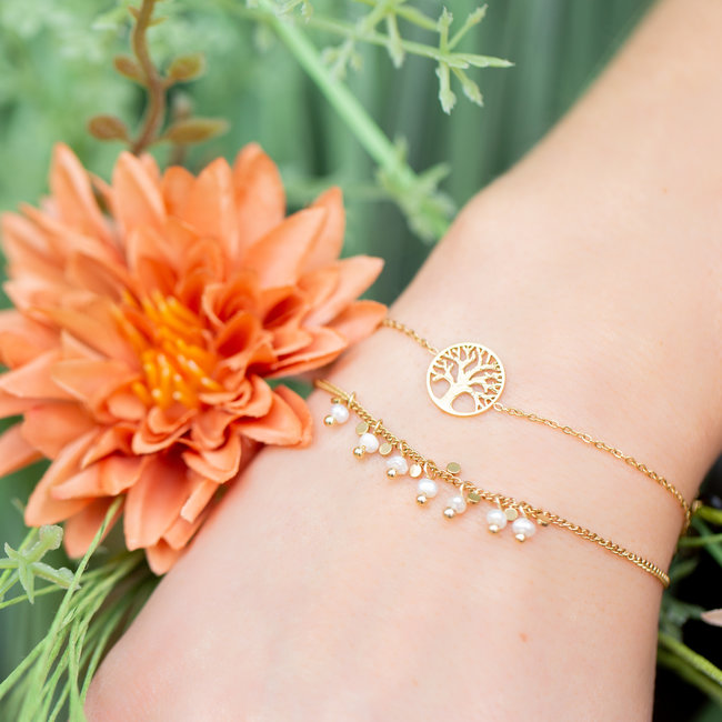Goud armbandje levensboom of witte pareltjes