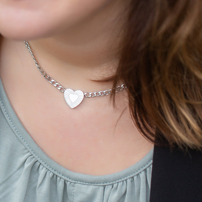 Zilver schakelketting met hart en stralen