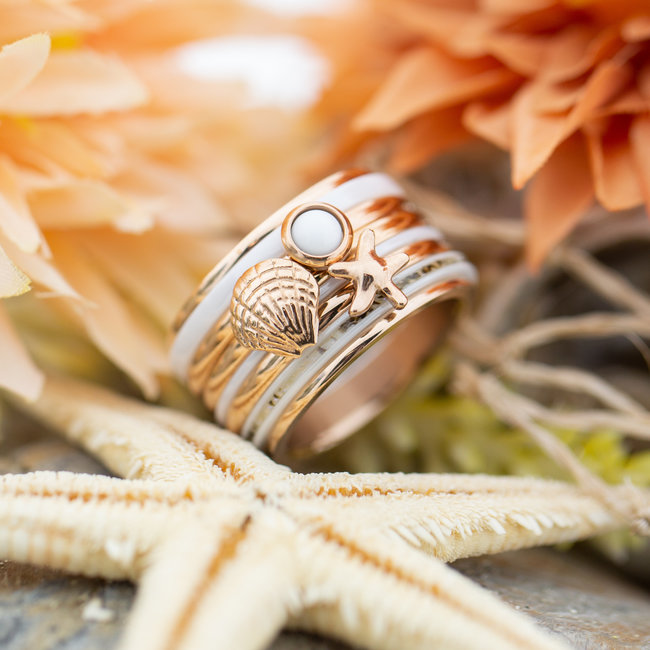 Complete ixxxi rosegoud ring met schelp en zeester
