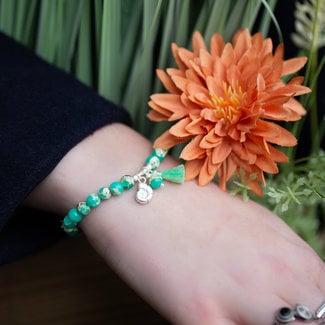 Biba Kralenarmband groen met schelp en kwast