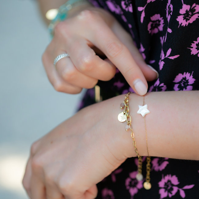 Gouden armbandjes met ster of muntje