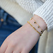 Day & Eve  Goud schakelarmband of bedels
